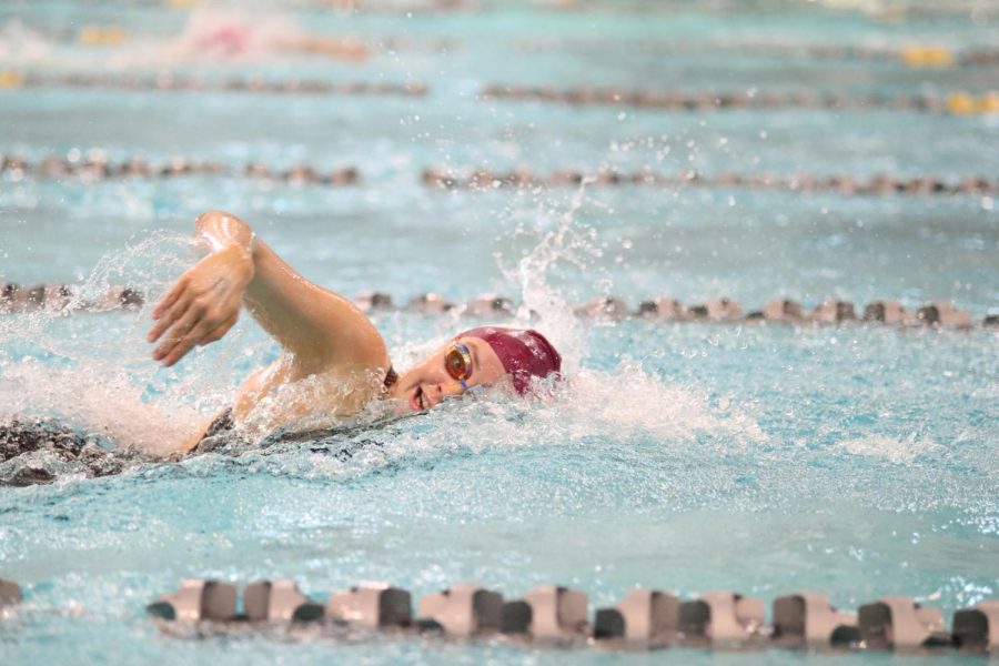 While swimming the 400 free relay, senior Abby Wampler turns to take a breath. The relay placed 16th at the State finals on Feb. 18 at St. Peters Rec Plex, which made it the school’s first relay in a decade to place in the top 16 at State. 