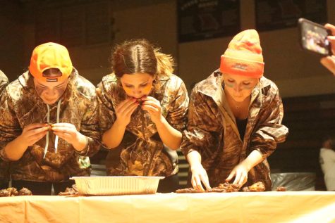The annual Battle of the Bones competition took place on April 9 as sophmores Claire McCarthy, Natalie Perone, and Meredith Fisher eat wings to help lead the girls
soccer program to victory against the boys baseball program. “Not gonna lie, it was a bit disturbing to watch, and I won’t likely be eating wings for some time,” judge
Mary Jo Bauer said.