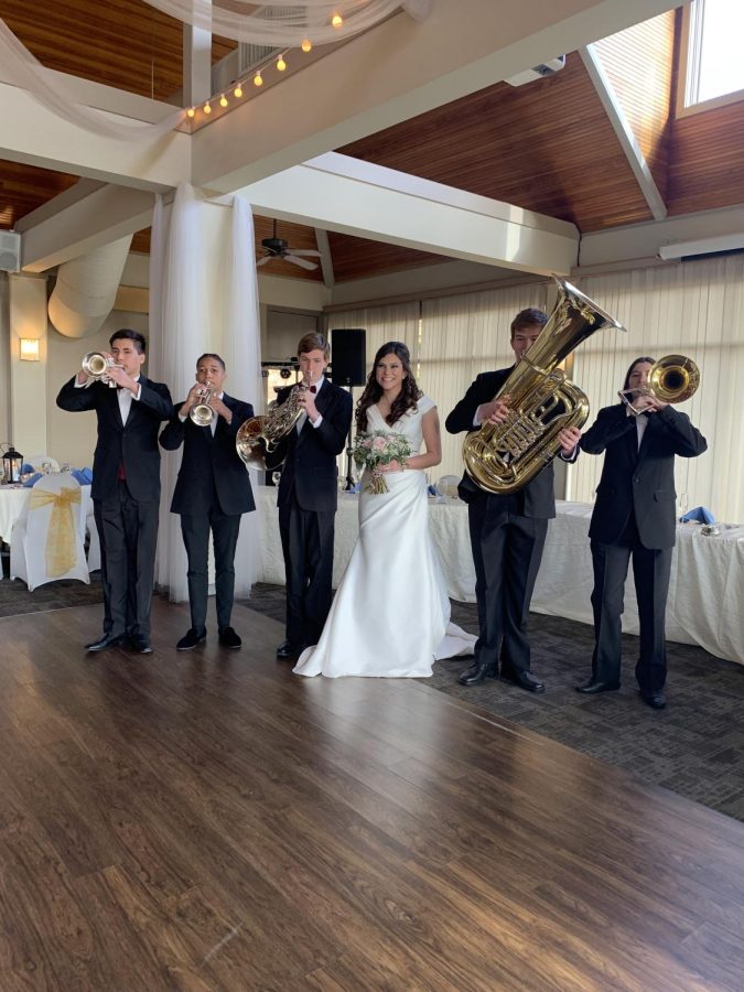 Junior+Blaine+Baker%2C+sophomore+Minko+Brown%2C+senior+Ethan+Holtzman%2C+science+teacher+Angela+Schneider%2C+and+seniors+Eddie+Cassimatis+and+Abby+Skelly+hold+up+their+instruments+at+the+wedding%2C+help+April+2nd.+%28Photo+used+with+the+permission+of+Angela+Schneider%29