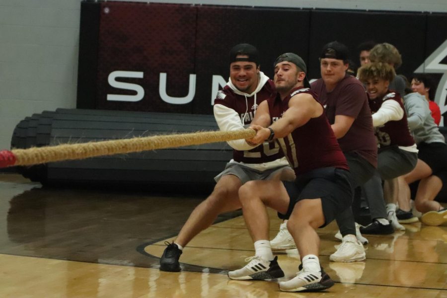 While playing tug of war during the pep rally seniors Caelin
Stegmann, Dominic Nenniger and Zach Ligget fight against
the juniors.The seniors lost to the juniors after more students
ran from the stands to help.
