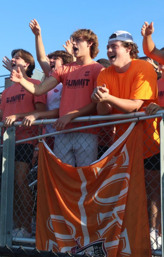 Seniors Brendan Moehle, Gavin Greenwalt, Zach Liggett
and junior Sam Bellamy cheer on the boys soccer team,
as the Falcons defeat the Jackson Indians 4-1 on Aug. 27 at home. 