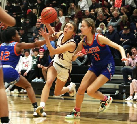 As junior Cece Hoeflinger (10) brings the ball down court, Clayton’s
Taylor Miller (12) and Genevive Roach (11) close in on her and force
her to lose control. The Falcons beat the Greyhounds 64-46 on Feb. 17.
