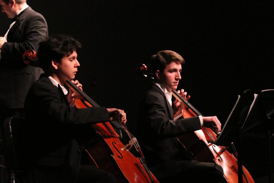 As+a+part+of+the+symphonic+orchestra%2C+seniors+Jarom+Robeck+and+Christian+Larsen+perform+as+soloists+during+Concerto+for+Two+Cellos.+The+orchestra+played+the+concerto%2C+along+with+many+other+songs%2C+at+their+spring+concert+on+May+9.