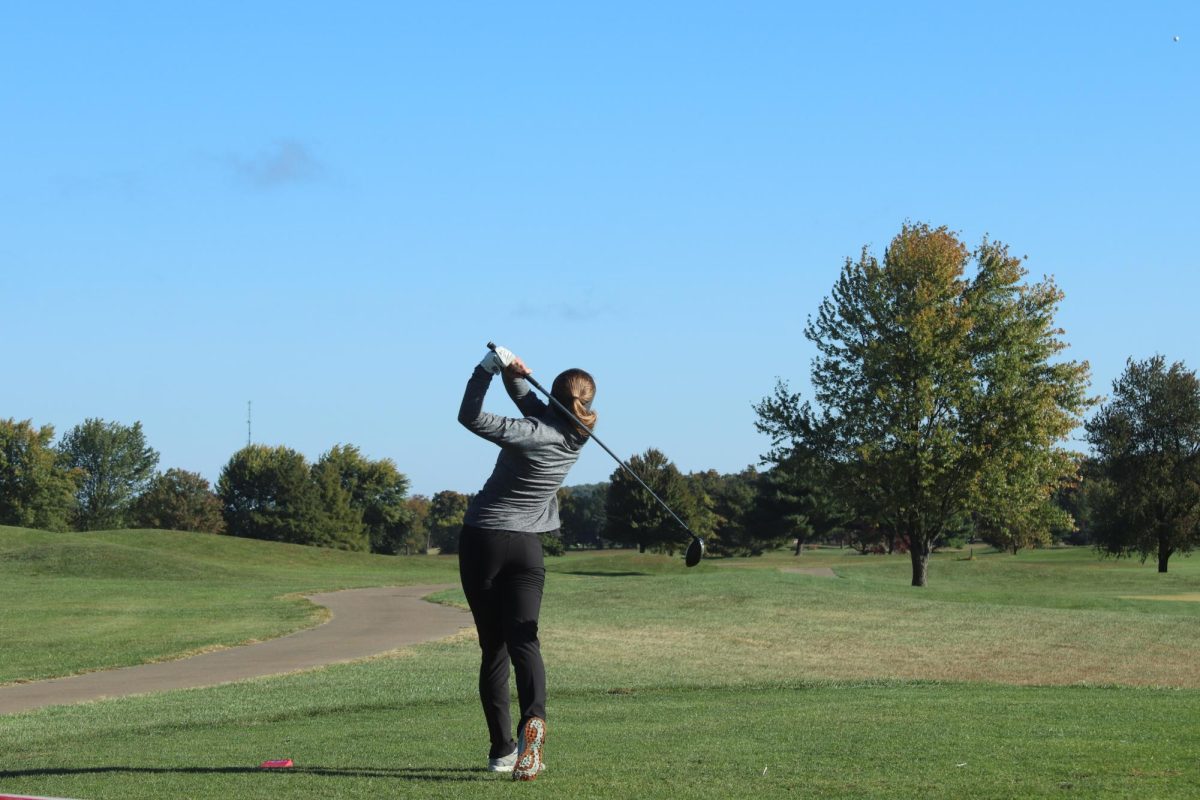 As she hits the ball, senior Madeline Gregston watches the landing to see where her next swing will be from. Gregston recieved a score of 197, placing 79th. The team recieved third place in state on Monday Oct. 16. 