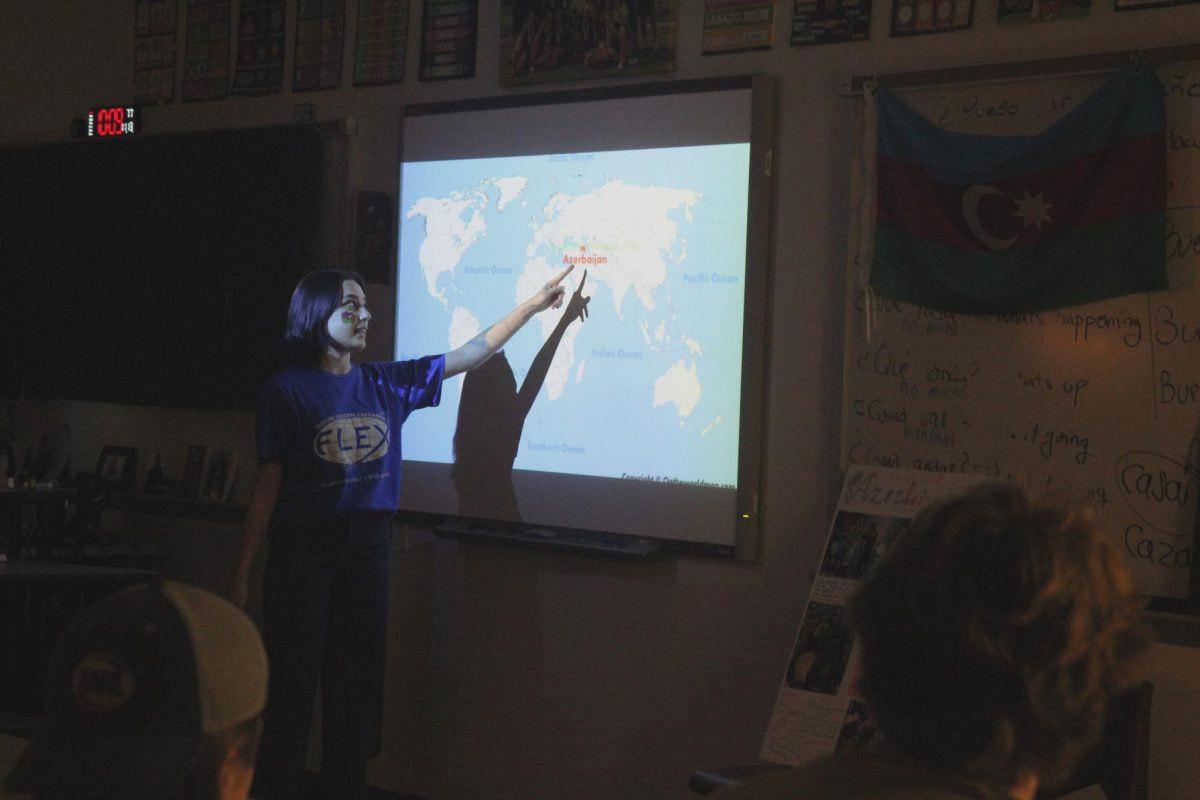 In front of the class, senior Gulay Aliyeva shows her classmates where Azerbaijan is on a world map. Aliyeva presented to Hills 4th hour spanish class on Nov. 13 for her foreign exchange program.