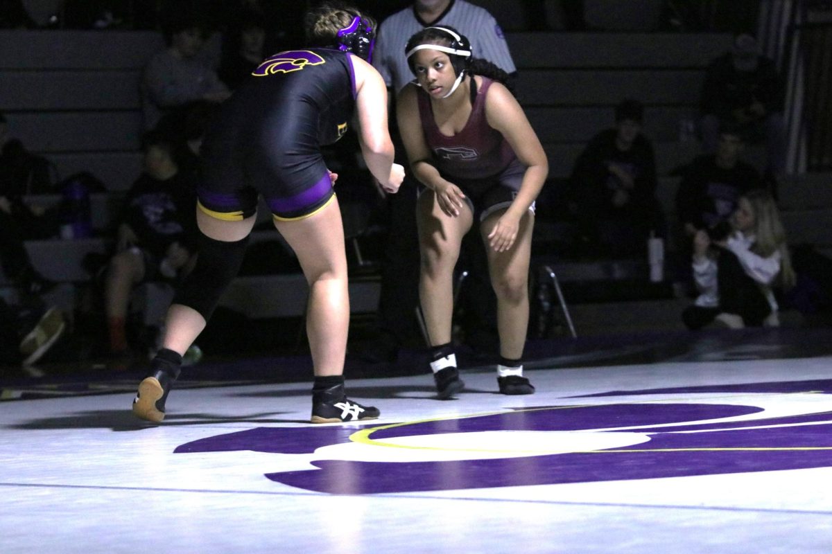 As she prepares to pounce, junior Zakiyah Fleming
stares down her opponent. Fleming won her match
at this meet which took place on Nov. 30 at Eureka.