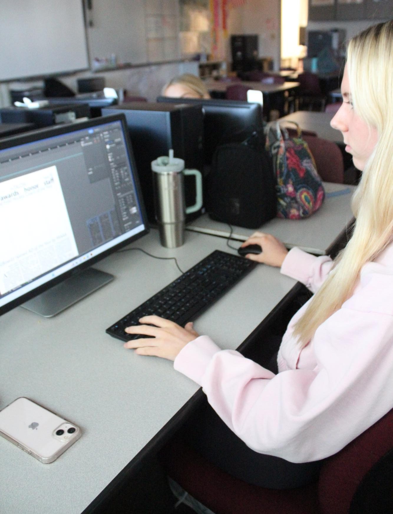 Junior Lily Maginn works using Indesign to create a page for the upcoming edition.