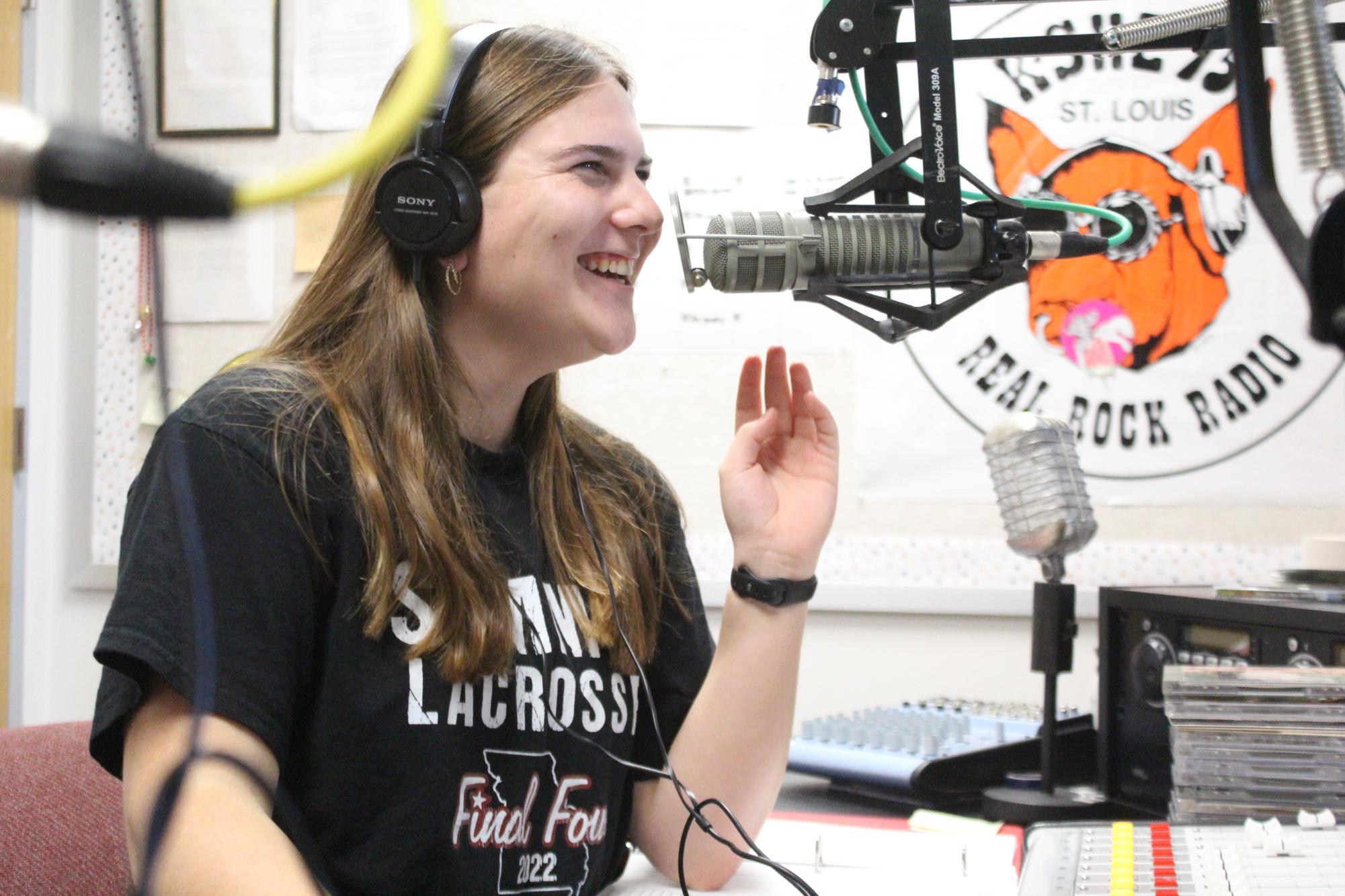 Senior Jenna Elmore laughs while live on air during an air shift.