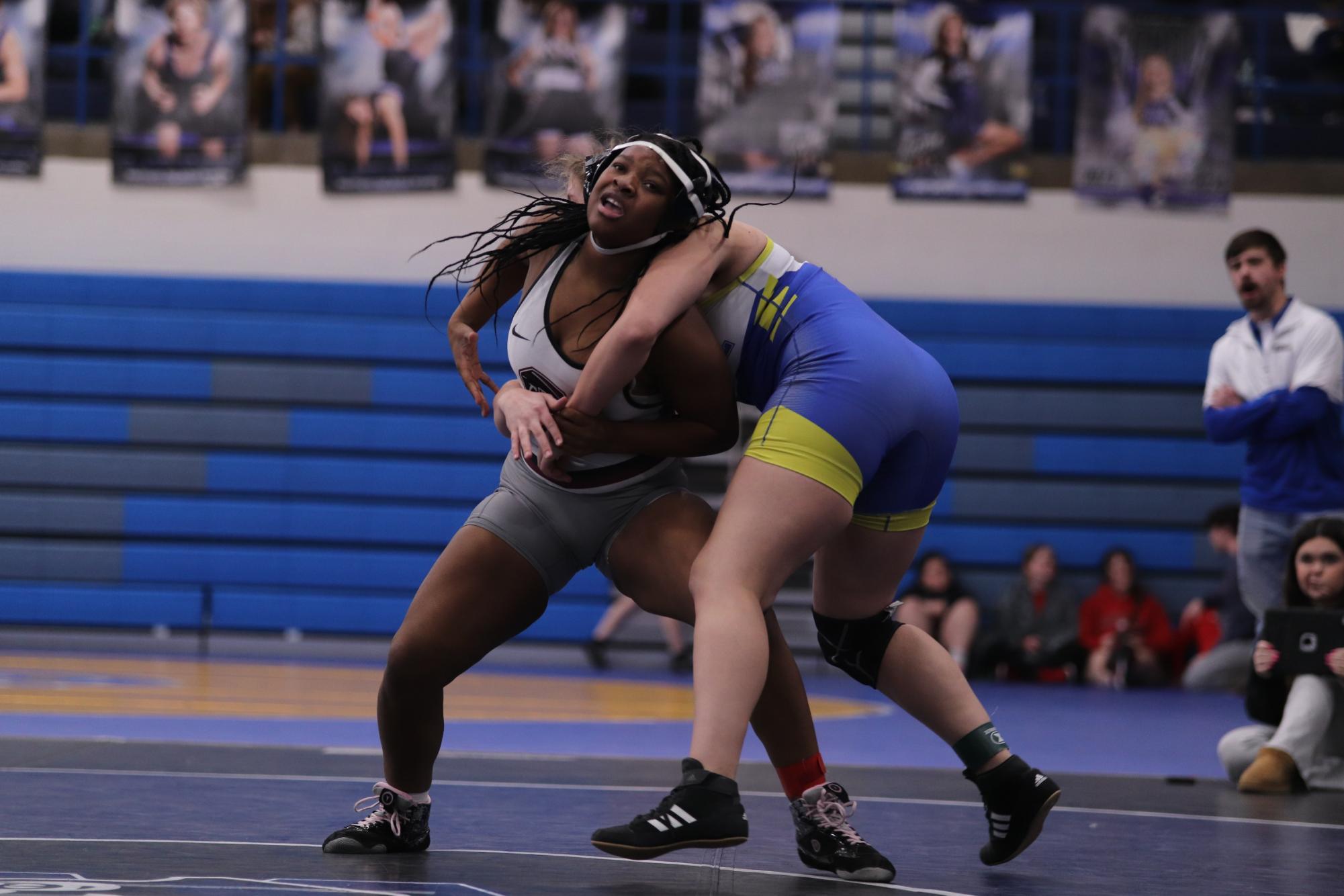 In an attempt to hold her ground, sophomore Jacida Kirk pushes her opponent off of her to get out of her grasp. The tournament took place at Washington High School on Jan. 19.