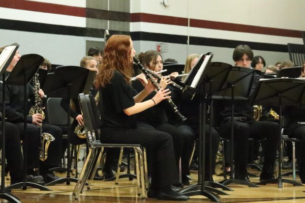 Junior Madeline Kelly plays the clarinet at the MIOS band concert last month. “The MIOS concert was a good opportunity to showcase the music weve been working on to our community and to see what we need to improve on before our large-ensemble contest and our spring concert,” Kelly said.