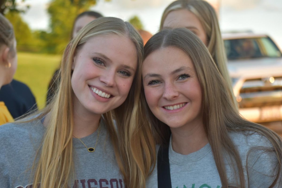 Seniors Macy Sutton and Maddie Gibson pose for a picture at Senior Sunset. The event took place in the parking lot on May 10.
