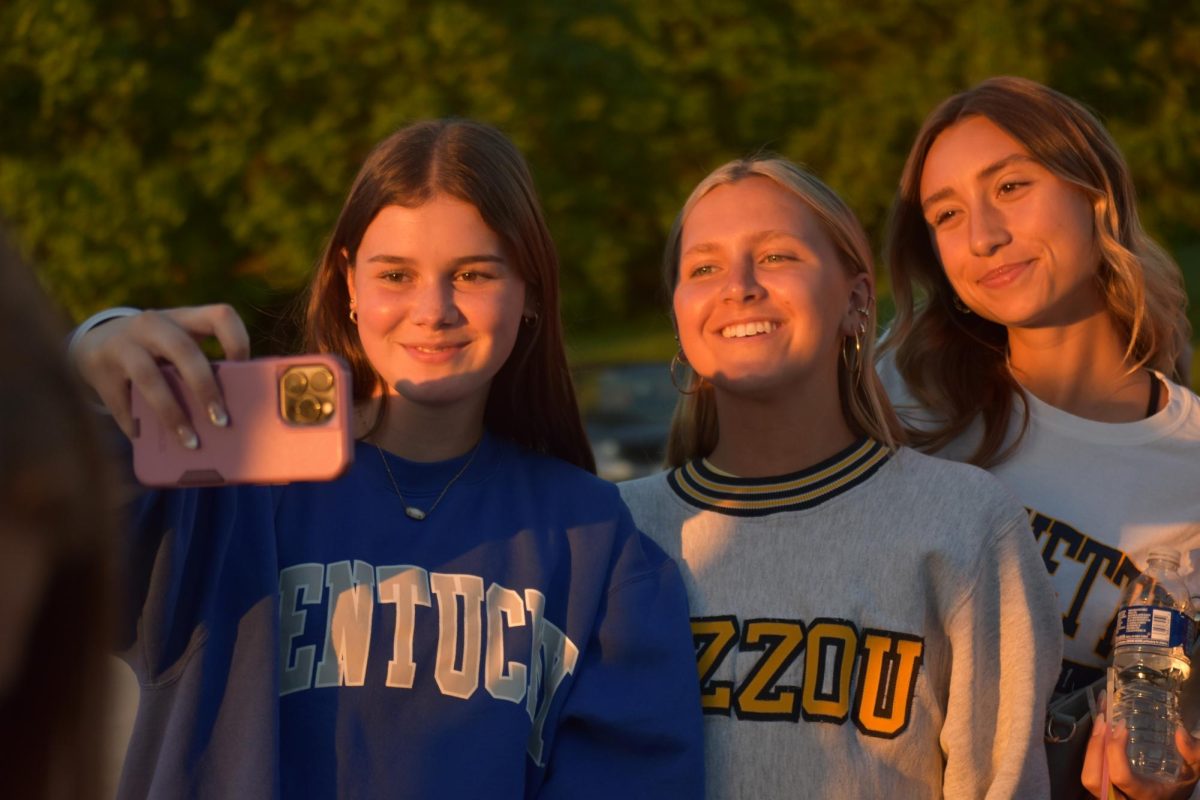 Seniors Claire McCarthy, Meredith Fisher, and Kami Beaton take a selfie together at Senior Sunset to commemorate their last year together.
