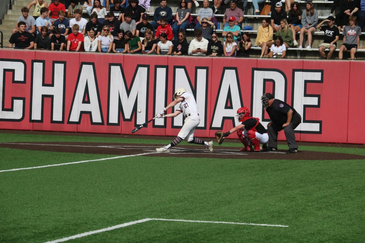 As the pitch comes flying towards him, sophomore Wyatt Schneider swings for the ball. Schneider scored 2 runs during the game. 