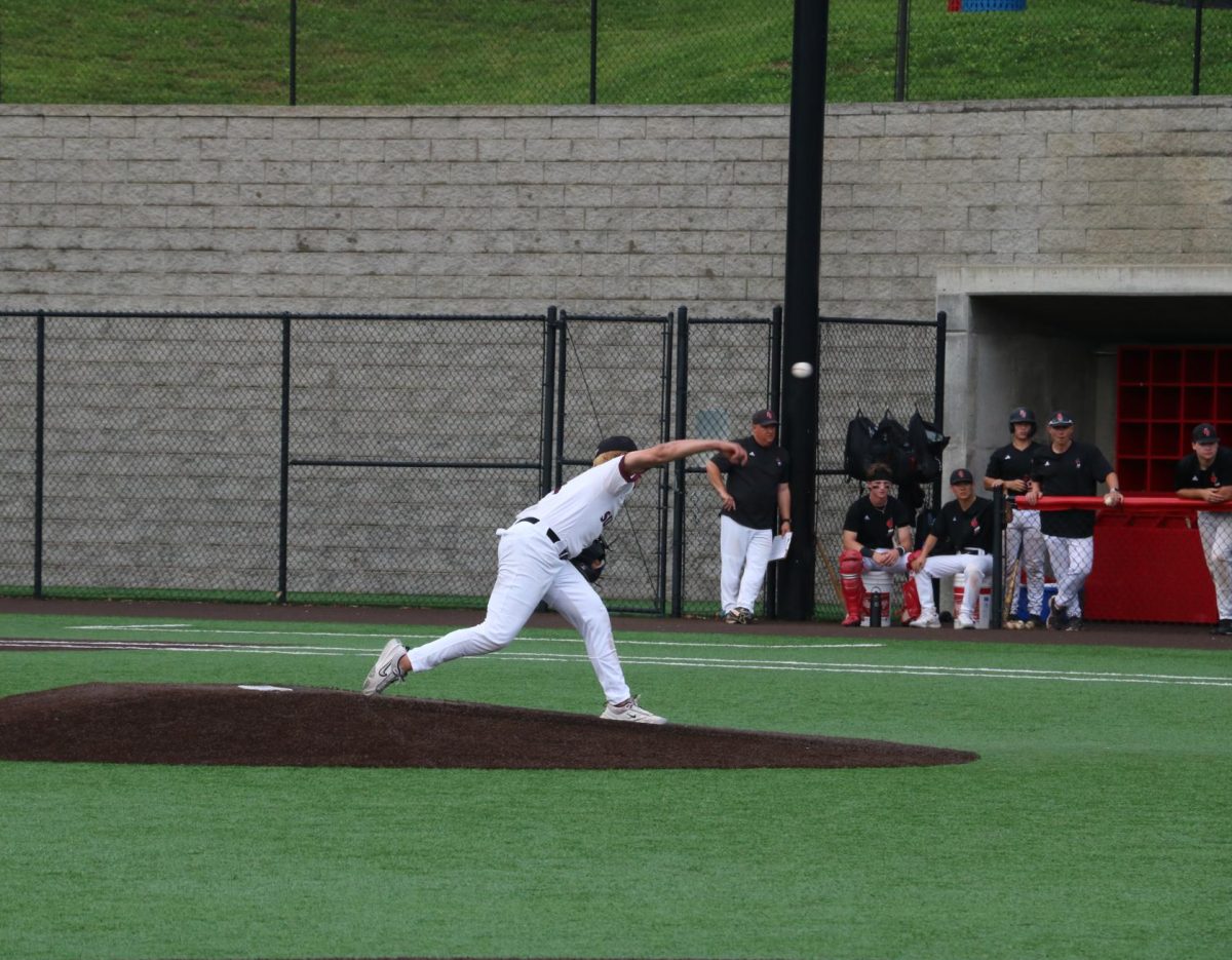 Junior Gabe Sieve pitches the baseball. 