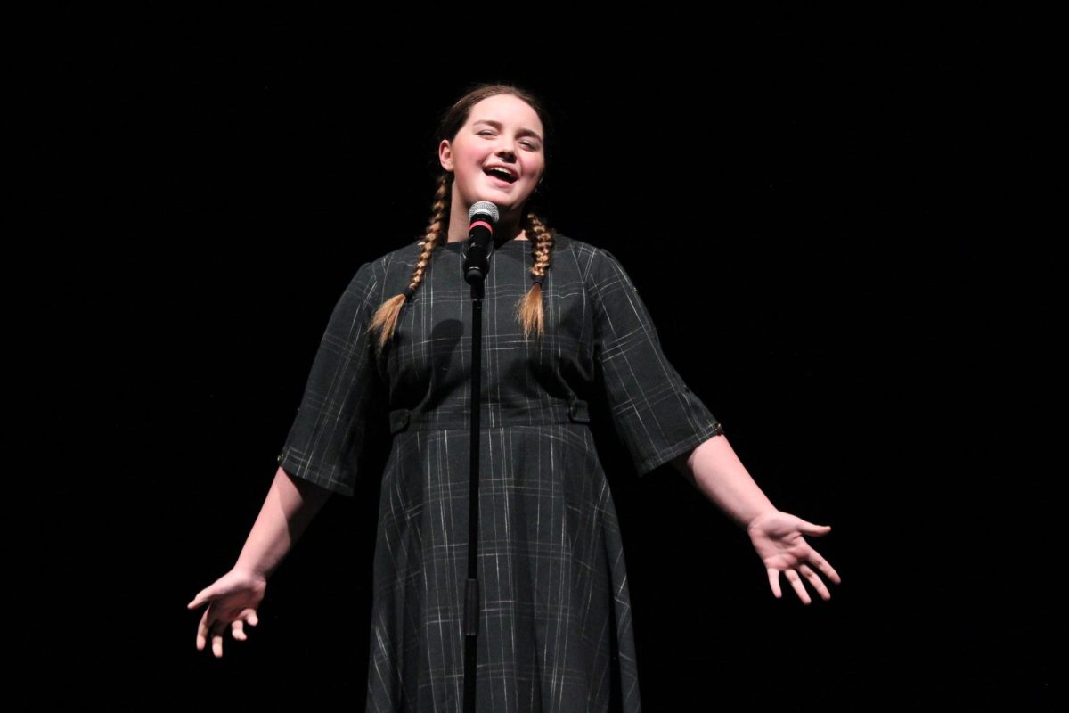 Singing along to Tomorrow from the musical Annie, freshman Becca Wirthlin performs in Scenes From Seasons Past. The show took place on April 26 and 27.