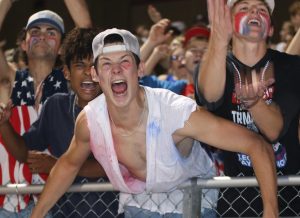 Seniors Thomas Hutzler, Anthony Cervantes, Army General Austin Althoff, and Brady French cheer on the Falcons as they score a touchdown. The home opener football game took place on Sept 13.