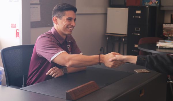 New freshman principal, Dr. Flores introduces himself to senior, Lily Trueman before interviewing her about 
her plans after high school. 