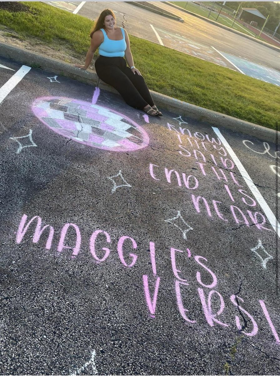 Maggie King poses with her Taylor Swift themed parking spot.