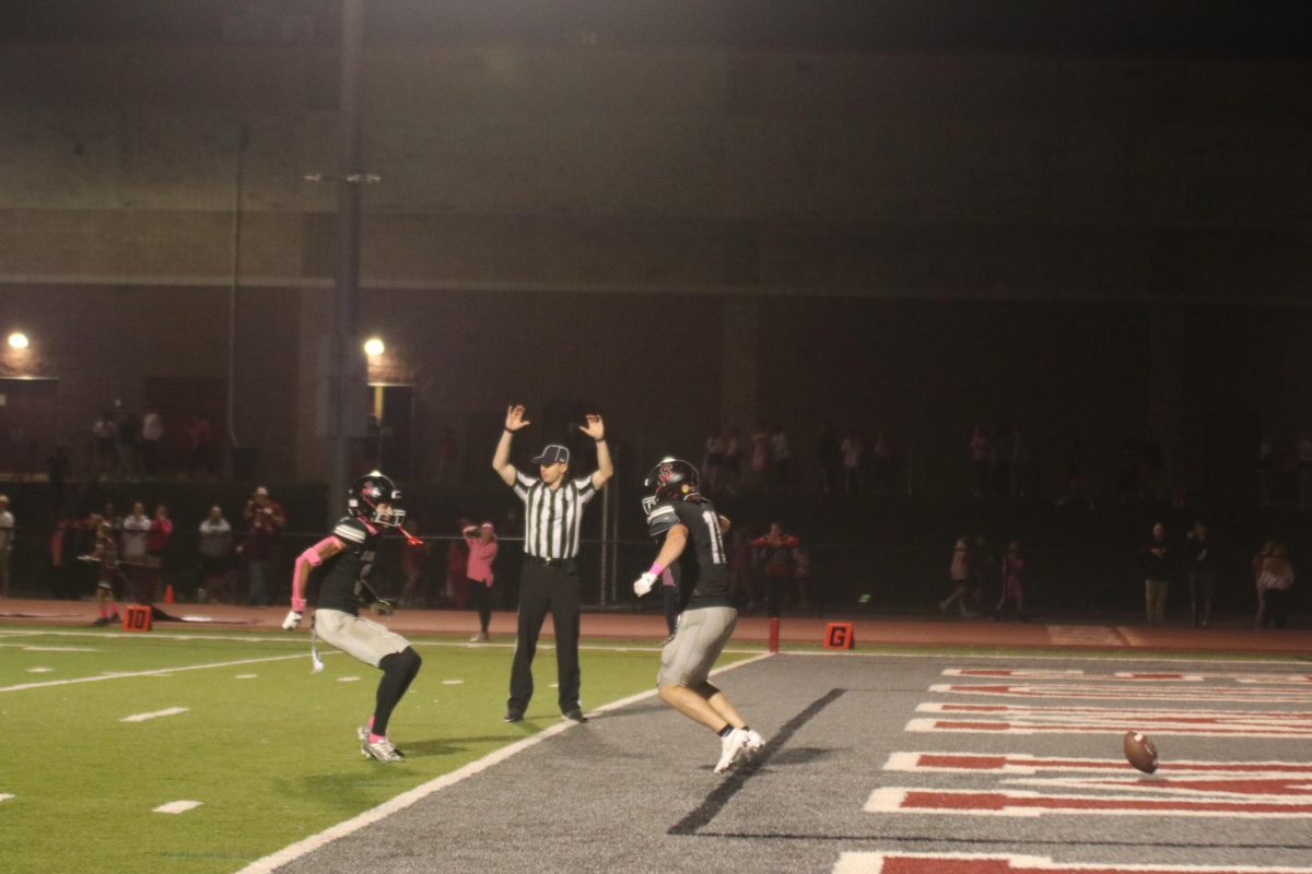 After Senior Blake Bell scores a touchdown for the Falcons, Junior Jasahn Tiller celebrates with him. The Falcons defeated Ladue 38-35 on Oct. 10.