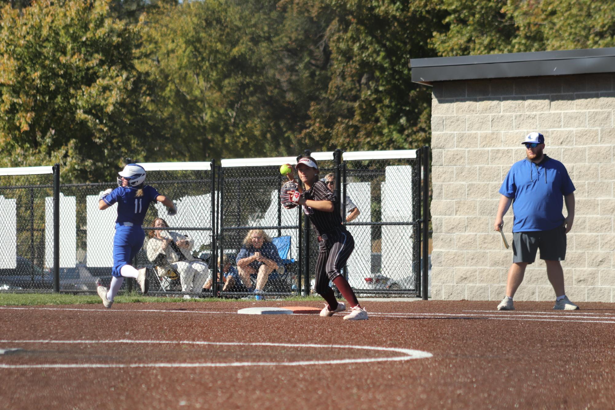 Softball wins round one of districts 5-4 in tight game with Washington Bluejays