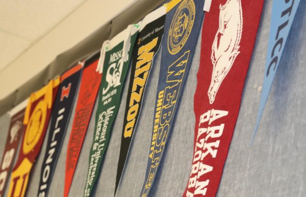 Banners hang in front of the counseling office representing Falcon's college choices. 