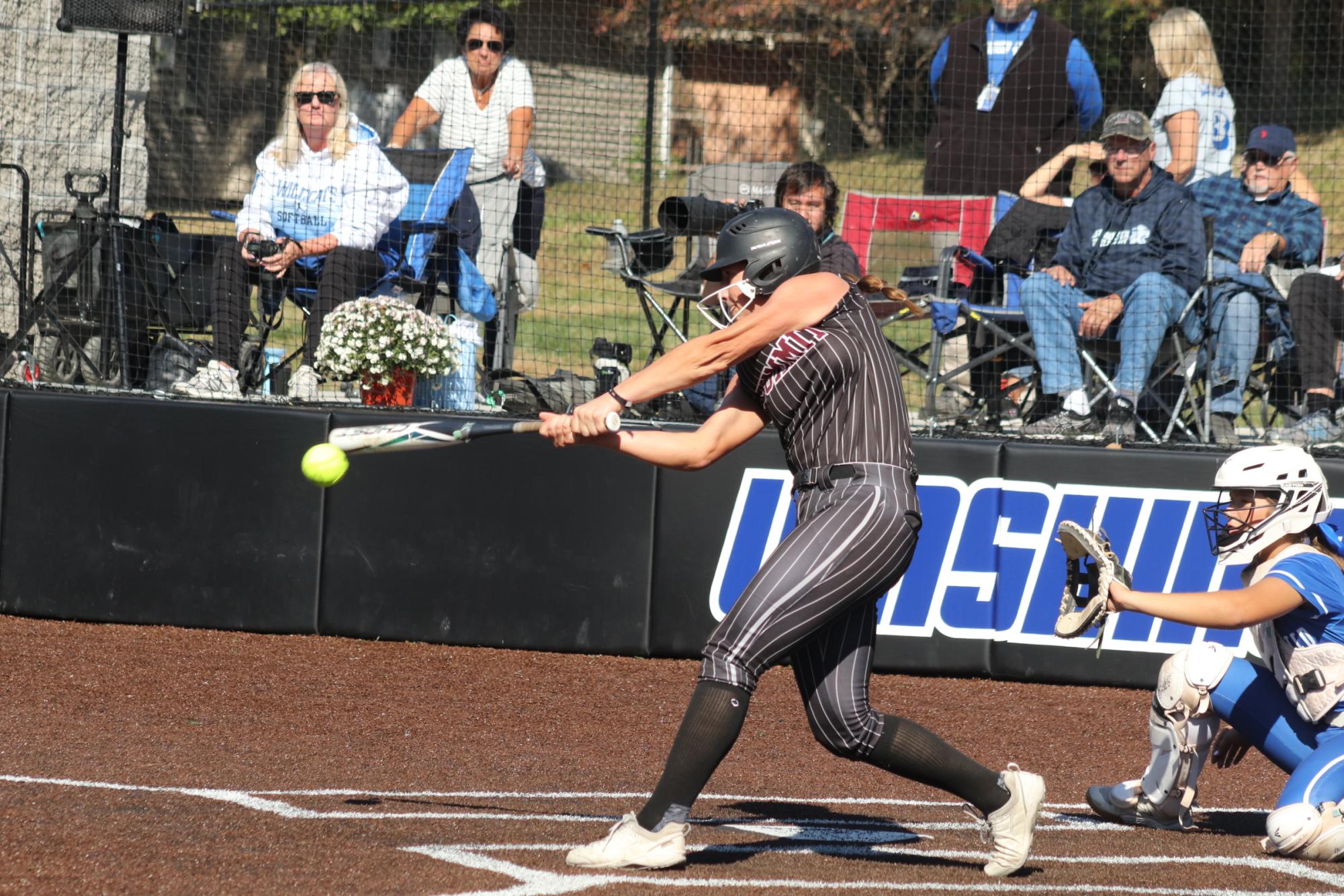 Junior Paige Bray hits a ball pitched from Westminster on Oct. 19. The Falcons were beat by Westminster in the district final 2-4.