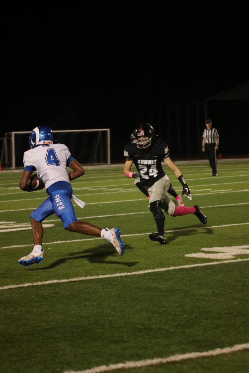 Jackson Cornett (24) chases Evan Via (4) of Ladue, trying to take the ball.