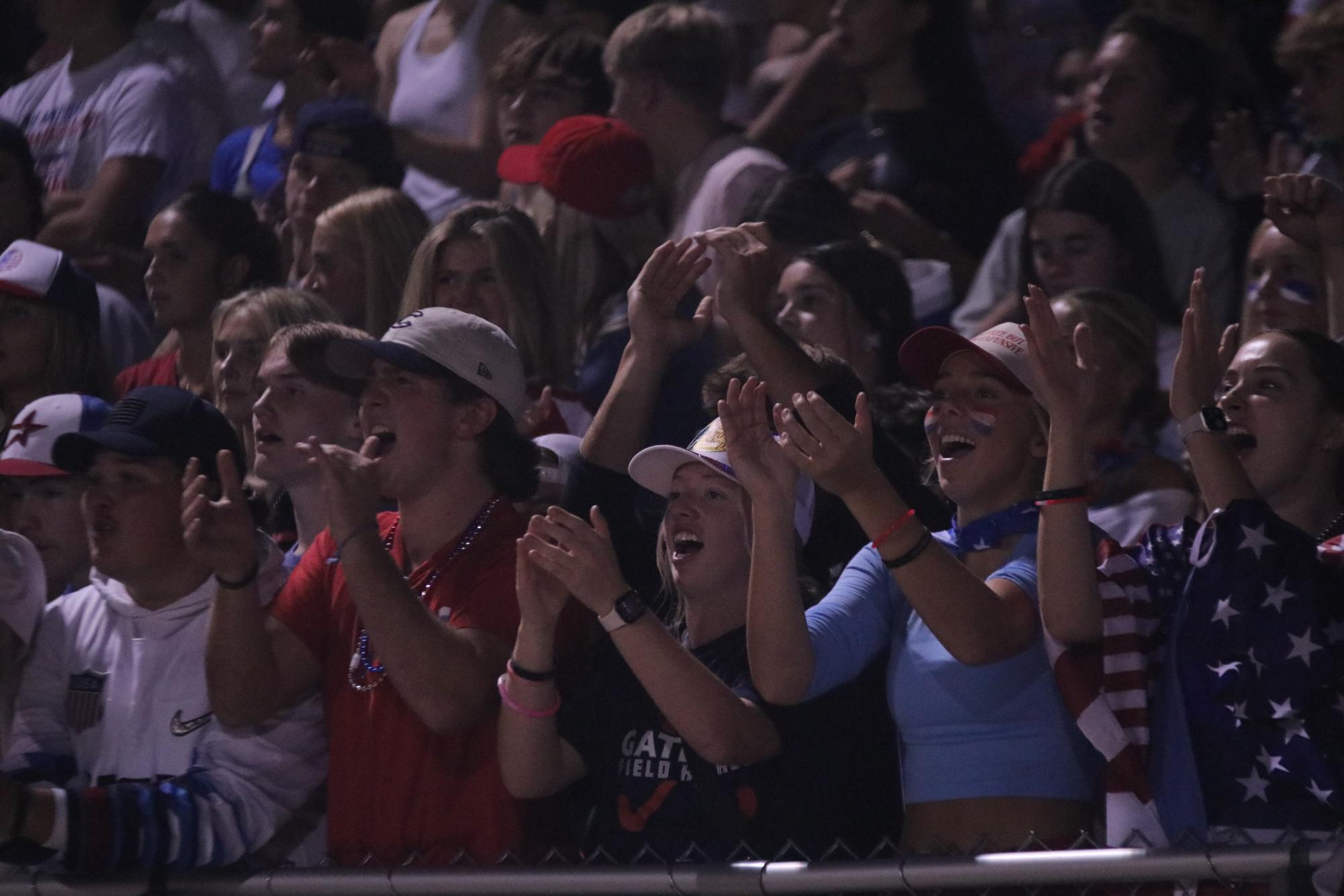 During the football game on Sept. 13th at home seniors Logan Hamilton, Dylan Weffelmeyer, Brooke Guthrel, Abby Glenn, and Madi Koke cheer from the student section. The falcons defeated Oakville 28-25.