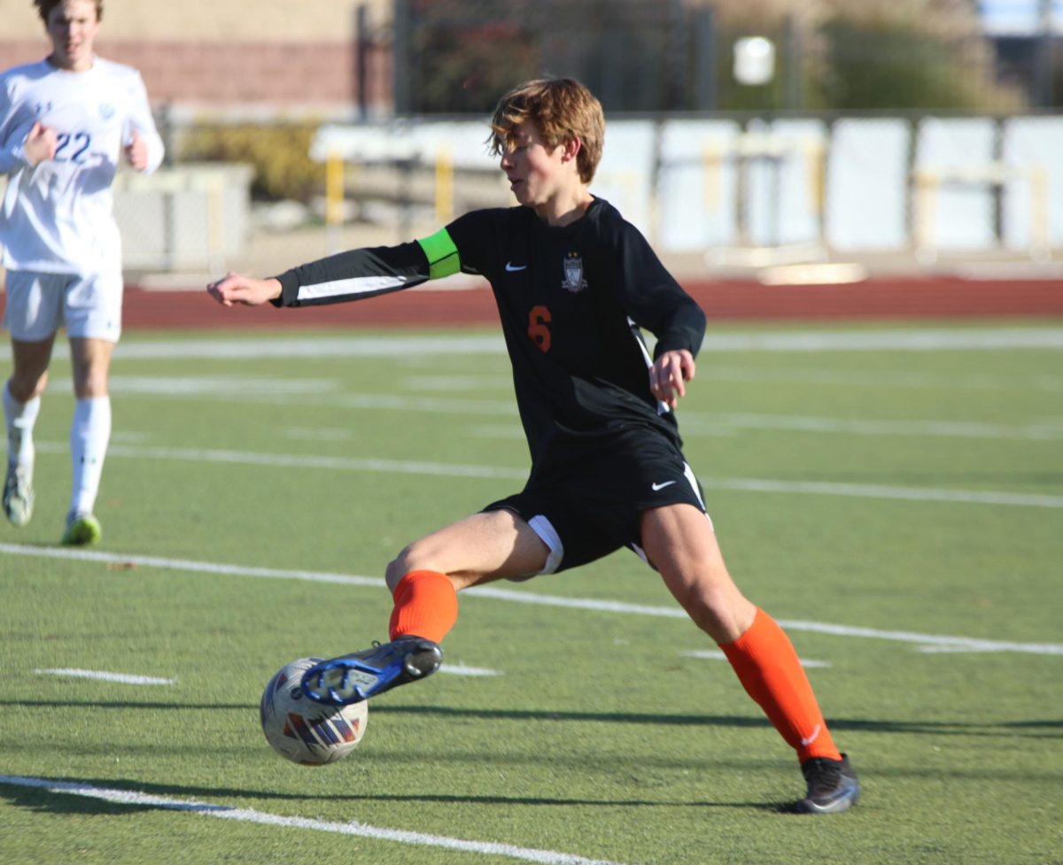 Dodging past his defender, Senior captain  James Berry moves down the field. Defeating the Blue Jays from Washington High School 4-0, the Falcons were able to move through to the second round of districts. 