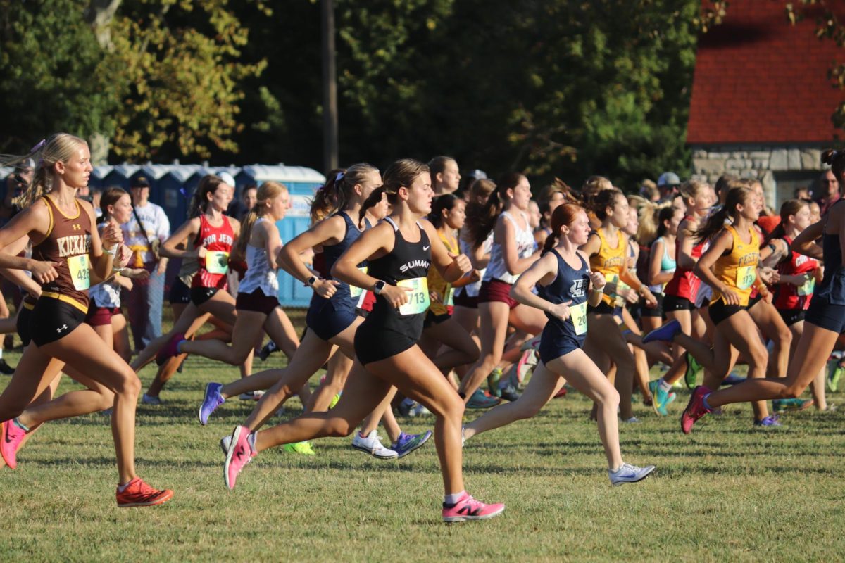 After the gun, senior Cate Rossomano begins her race at the Forest Park meet on Sept 14. 