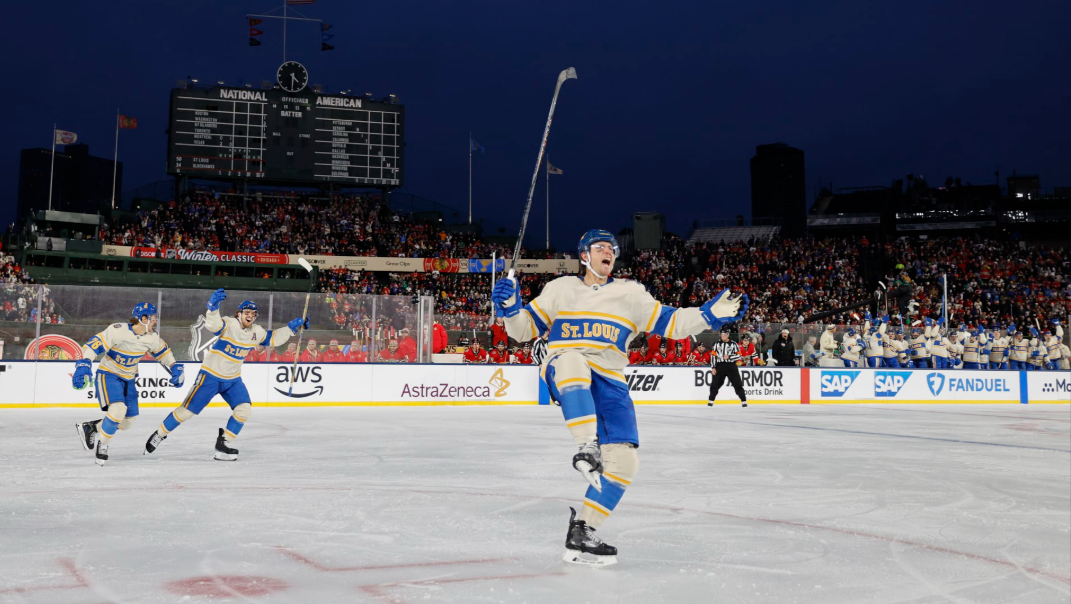 After scoring his first goal of the game against the Chicago Blackhawks, defenseman Cam Fowler celebrates with the crowd. Fowler went on to score another goal, propelling the team toward their 6-2 win. (photo used with permission from Dan O'Neill)