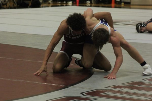 Sophomore Donovan Brown wrestles Northwest sophomore Kaleb Belcher at Summit on Jan 30. Brown lost his match, the team falling 6-72 against Northwest.
