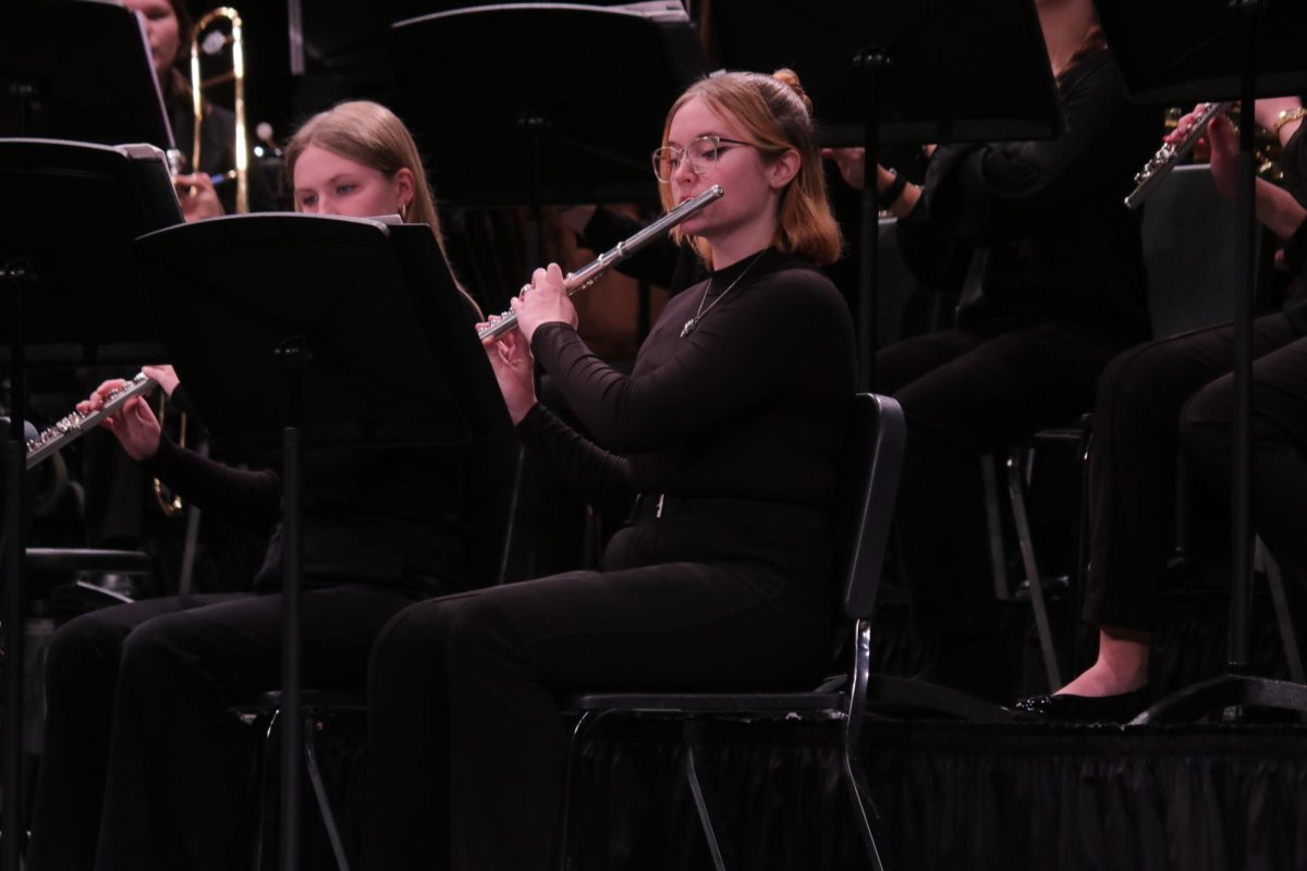 During the MMEA Practice Concert, senior Phoenix Honzell plays her flute.