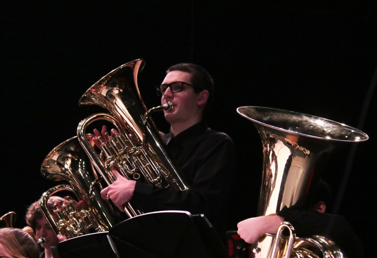 Playing his Tuba, senior Oliver Poertner performs at the MMEA Practice Concert.
