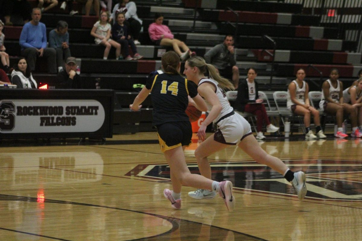 Senior Ryann Harness keeps the ball away from Lafayette sophomore Isabelle Hrdlicka.