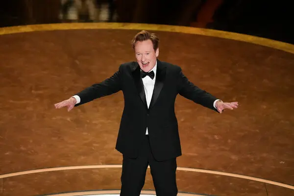 Conan O'Brien talking to the audience full of celebrities as he hosts the Academy Awards for the first time. (photo from the New York Times)