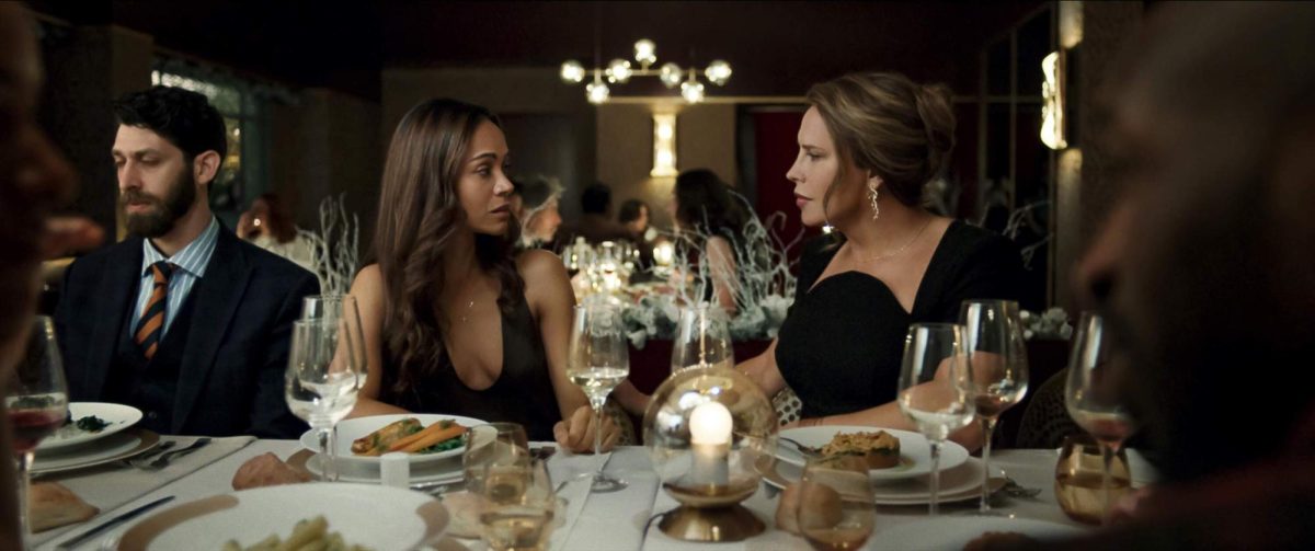 While having dinner, Rita Mora Castro (Zoe Saldaña) and Emilia Pérez / Juan "Manitas" Del Monte (Karla Sofía Gascón) discuss during the event. (photo from IMDB)