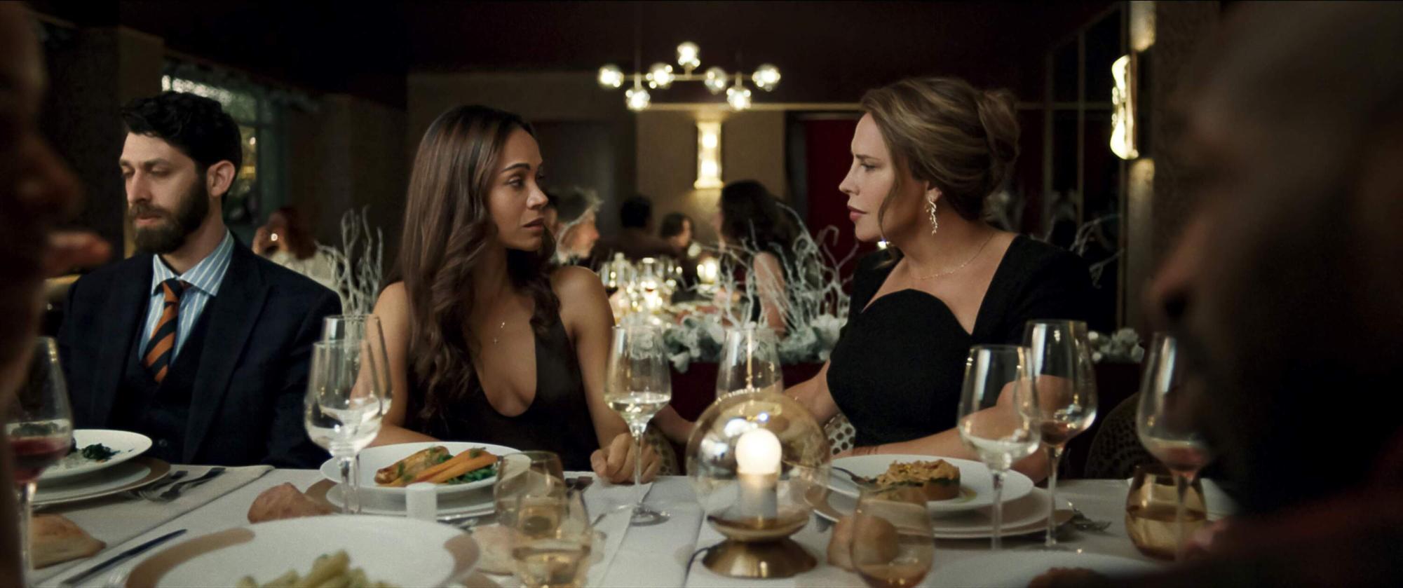 While having dinner, Rita Mora Castro (Zoe Saldaña) and Emilia Pérez / Juan "Manitas" Del Monte (Karla Sofía Gascón) discuss during the event. (photo from IMDB)