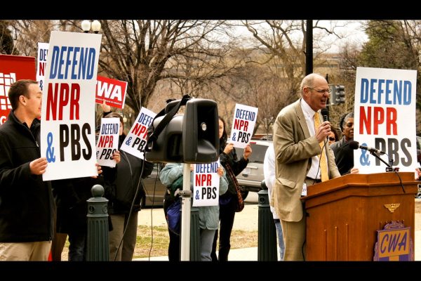 A Communications Workers of America  press conference being held across the street of the US Capitol building protesting for the federal support of funding National Public Radio and the Public Broadcasting System. (photo from the Denver Clarion)