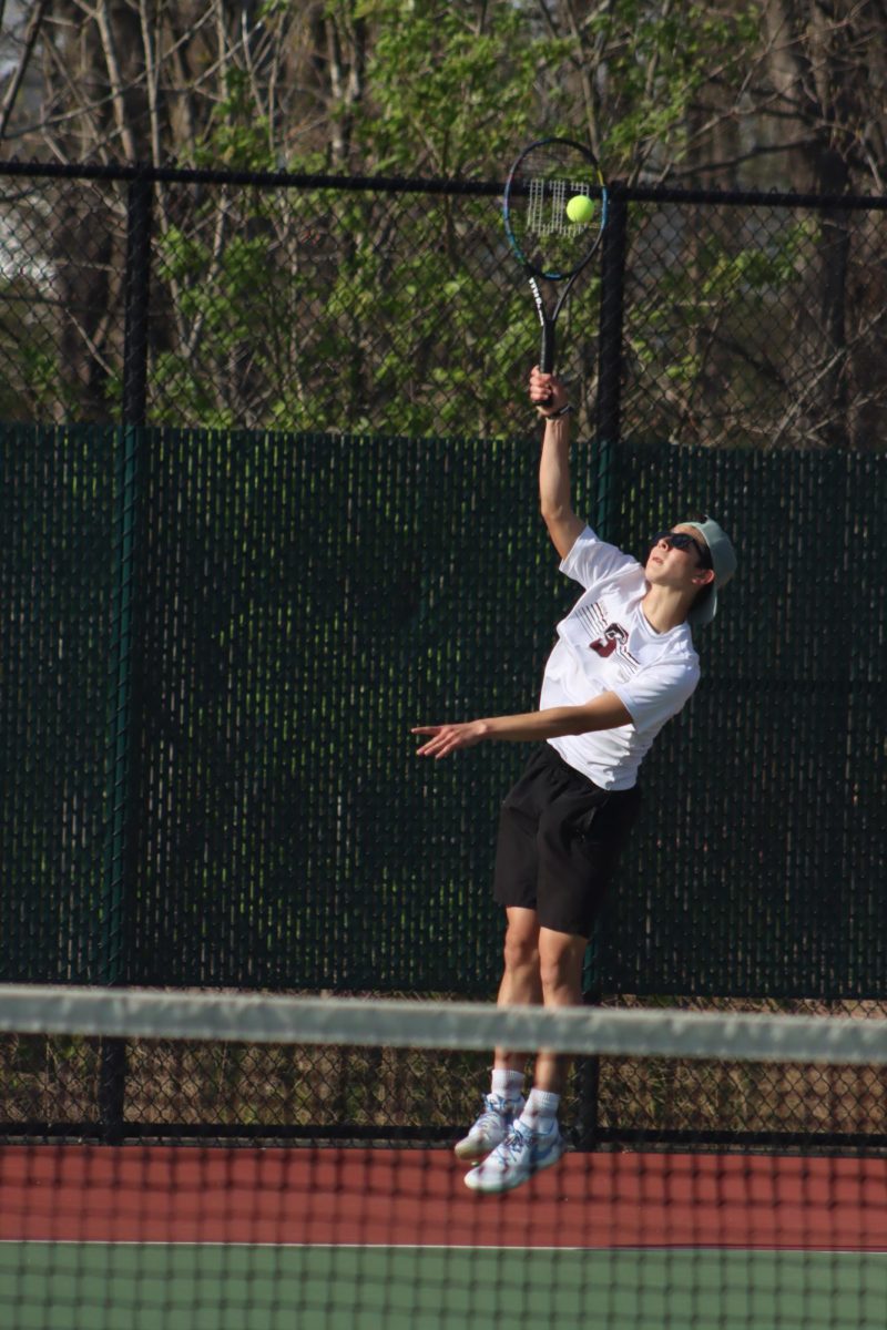 Junior Max Otto serves the ball to his Whitfield opponent on April 17. 