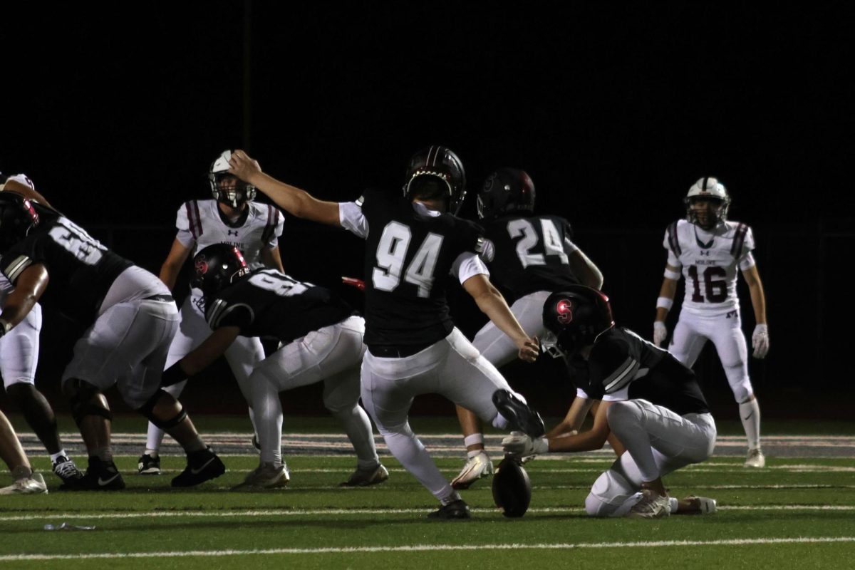 Senior Evan Wade scores a field goal on Aug. 29 at the home opener against Moline. The Falcons beat the Maroons 30-24. 

