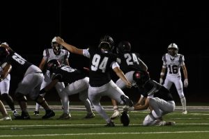 Senior Evan Wade scores a field goal on Aug. 29 at the home opener against Moline. The Falcons beat the Maroons 30-24. 
