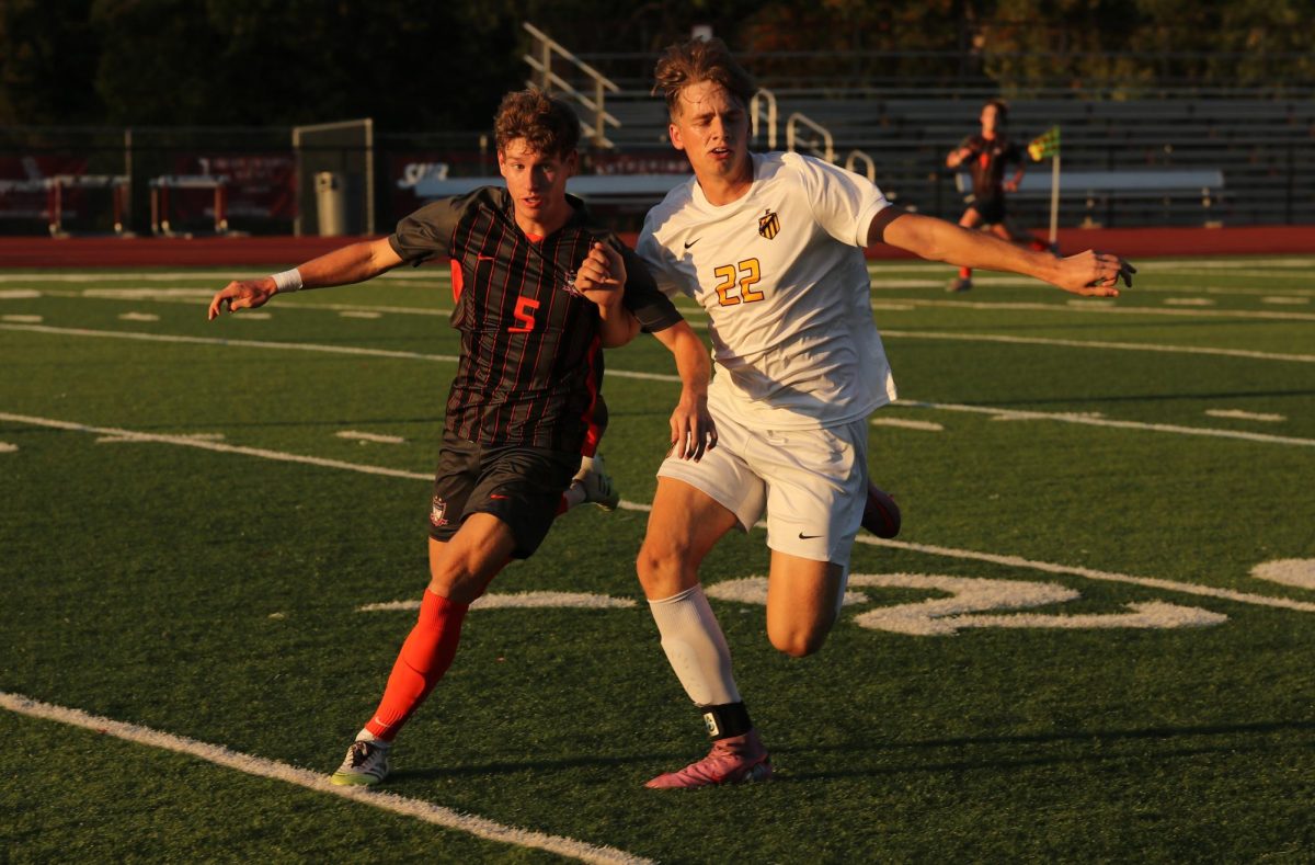 Looking for the ball, senior Chase Parmer (5) fights off Noah Emmerich (22) of Ft. Zumwalt East.