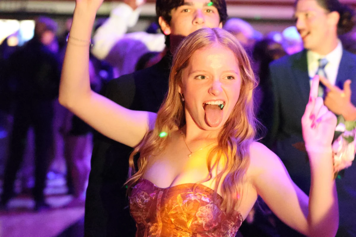 Senior Claire Worley dances with her tongue out at the homecoming dance. The homecoming dance took place Sept. 20, 2025 in the main gym.