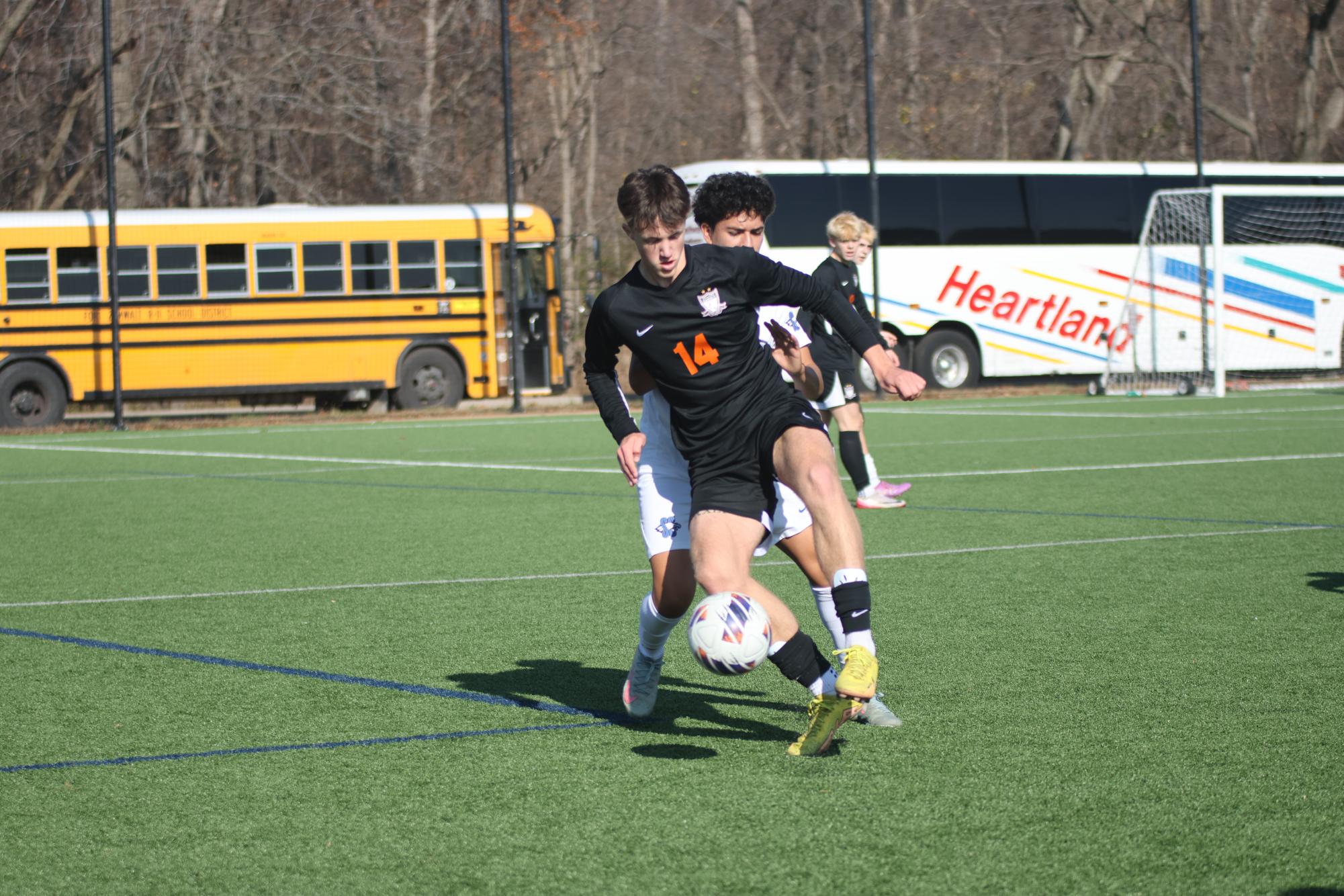 Dribbling the ball, junior Harper
Edwards fights against Summit
Christian Academy’s Troy
Warfield. The Falcons won 6-0 and
claimed third place on Nov. 22.
