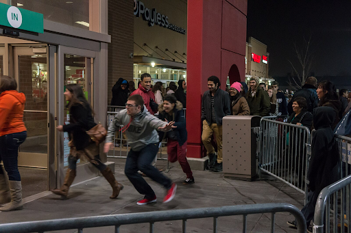 In Laramie, Wyoming, a crowd of people rush into a store to secure Black Friday deals. (photo from Wikimedia Commons)
