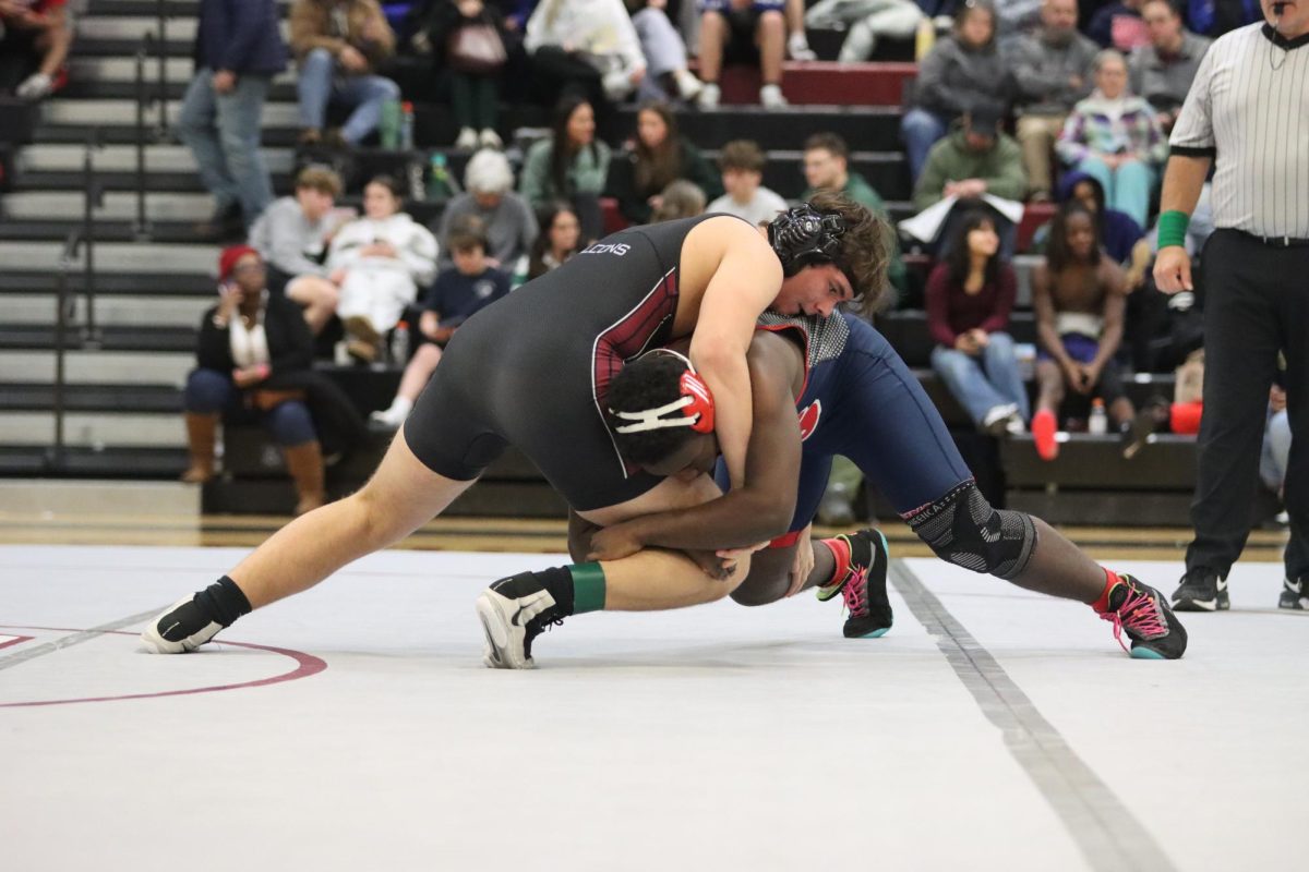 Pushing against Maslah Abdi of Parkway South, sophomore Brian King leans into the force. King won this match and moved on to the semifinals, eventually getting knocked out in his second match on Jan. 17.