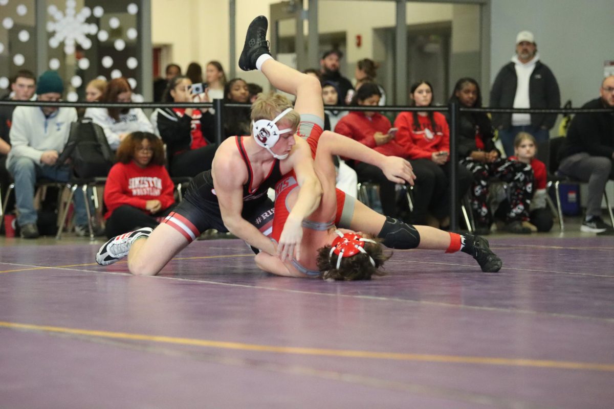 Junior Luke Hardee blocks himself from being flipped by Ben McDermott of Sikeston. At the Route 141 Rumble tournament on Jan. 17, Hardee placed fourth overall in his weight class.