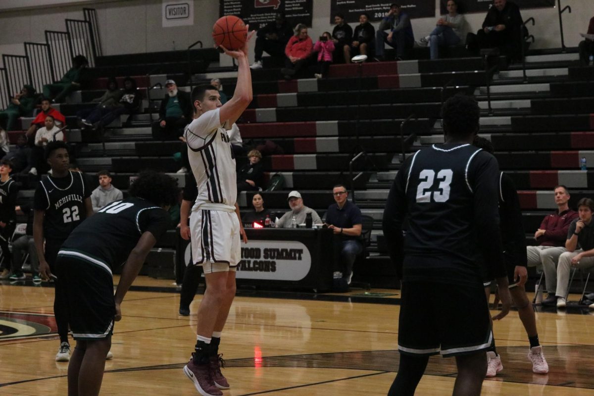 Shooting the ball, senior Oliver Puljic scores a free throw for the Falcons. The game against Mehlville took place on Dec. 18, the Falcons taking down the Panthers 64-45.