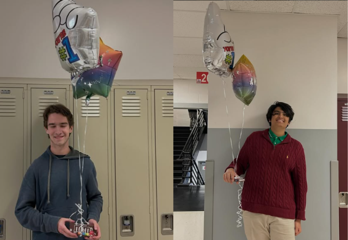 Senior Michael Charleston and sophomore Ishaan Banker pose with ballons and candy that were awarded to them for achieving a perfect score on the ACT. Summit's Prize Patrol recognized these students on Jan. 6. (photo from rshsfalcons on Instagram)